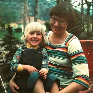 A young DK Stone sitting on mom's lap