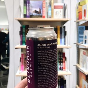 Beer can with a short story printed on the label.