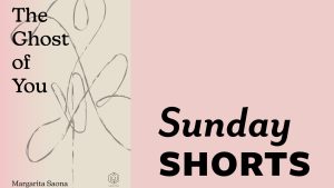 Feature Image for July 2023 Sunday Short: Sunday Shorts is written in black text on a pastel pink background. To the left of the text is the book cover for “The Ghost of You” by Margarita Saona.